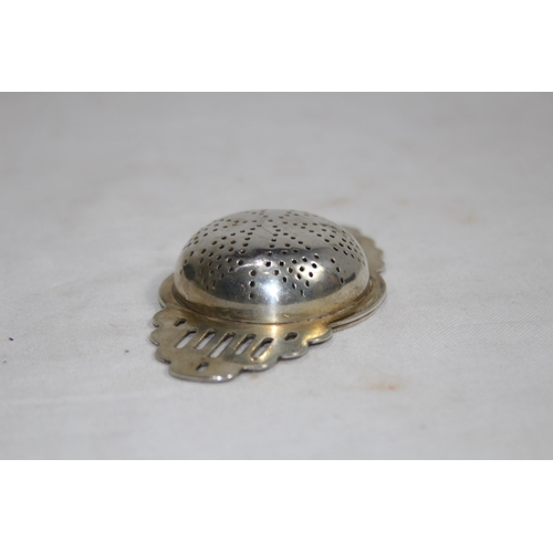 1128 - HALLMARKED SILVER TEA STRAINER - 40G