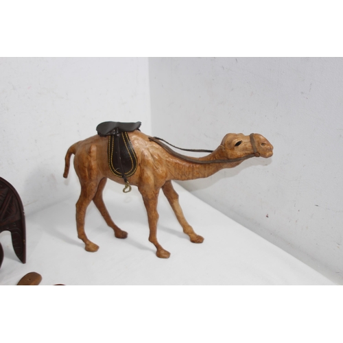 518 - QUANTITY OF TREEN INCLUDING 2 LEATHER CAMELS AND A WOODEN HORSE