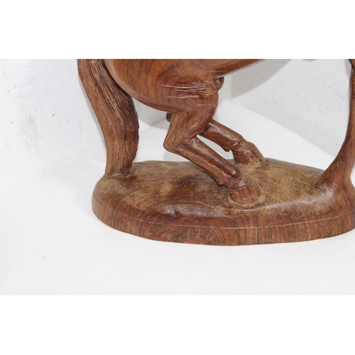 518 - QUANTITY OF TREEN INCLUDING 2 LEATHER CAMELS AND A WOODEN HORSE