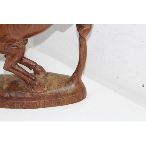 518 - QUANTITY OF TREEN INCLUDING 2 LEATHER CAMELS AND A WOODEN HORSE