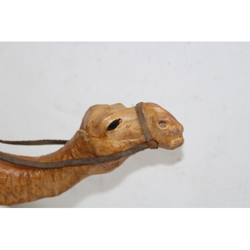 518 - QUANTITY OF TREEN INCLUDING 2 LEATHER CAMELS AND A WOODEN HORSE