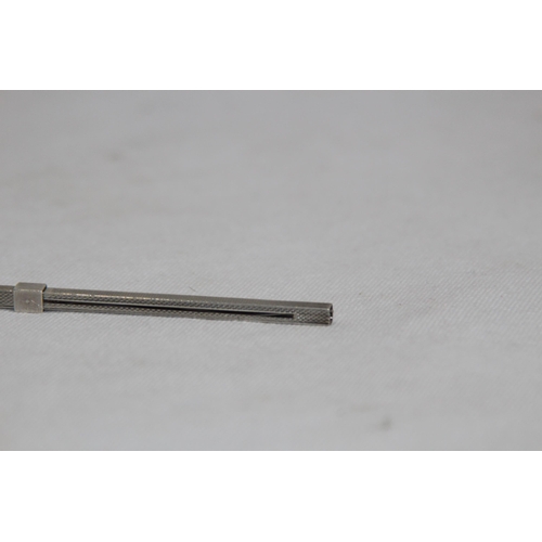 1151 - CHAMPAGNE SILVER SWIVAL STICK OF SQUARE FORM WITH ENGINE TURNED FINISH BY SJR LONDON