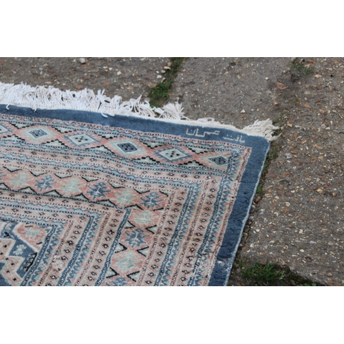 279 - LARGE HAND KNOTTED WOOL RUG
274 X 187CM