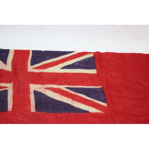 902 - EARLY 20TH CENTURY RED ENSIGN FLAG SHOWING SIGNS OF WEAR AND AGE 
86 X 46CM