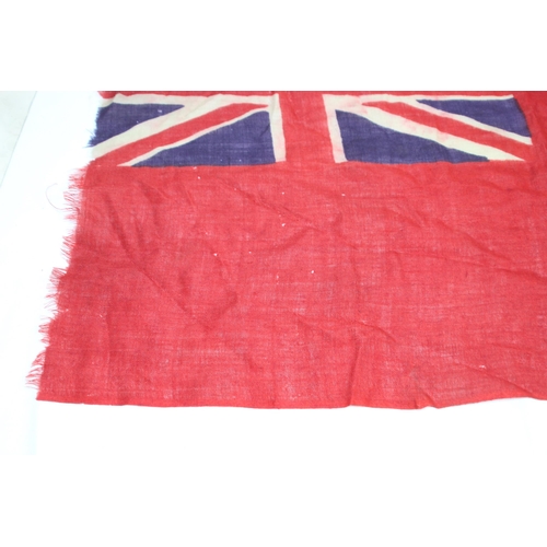 902 - EARLY 20TH CENTURY RED ENSIGN FLAG SHOWING SIGNS OF WEAR AND AGE 
86 X 46CM