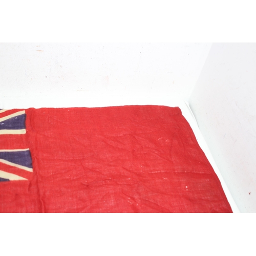 902 - EARLY 20TH CENTURY RED ENSIGN FLAG SHOWING SIGNS OF WEAR AND AGE 
86 X 46CM