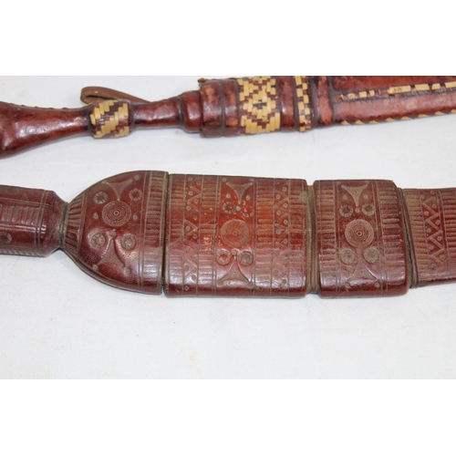 908 - TWO VINTAGE SWORDS OF AFRICAN DESCENT IN SCABBARD