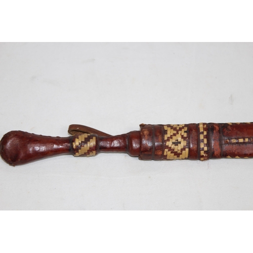 908 - TWO VINTAGE SWORDS OF AFRICAN DESCENT IN SCABBARD