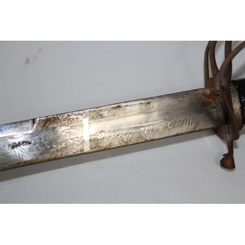 909 - INDIAN FORGED CURVED SWORD IN SCABBARD WITH ETCHED BLADE