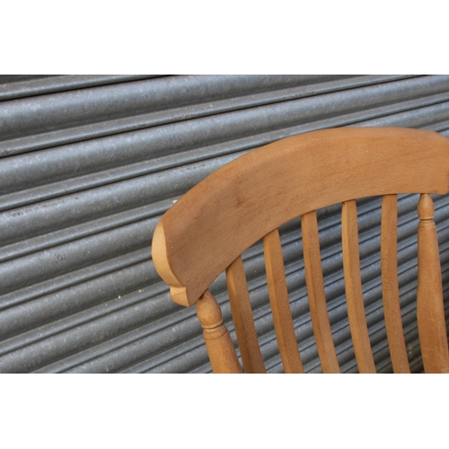 105 - NATURAL PINE FARMERS FIRESIDE CHAIR 
67 X 52 X 113CM