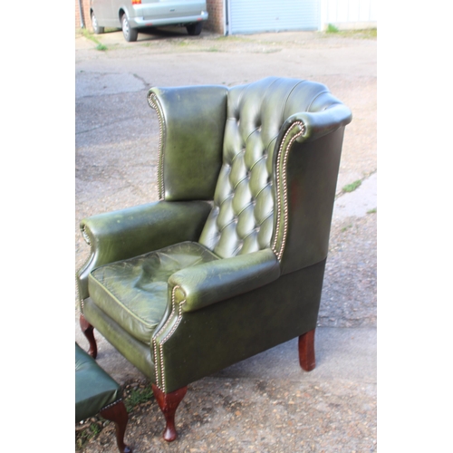 108 - GREEN LEATHER  CHESTERFIELD WINGBACK ARMCHAIR AND FOOTSTOOL
93 X 80 X 106CM