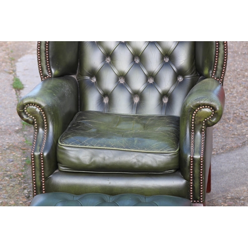 108 - GREEN LEATHER  CHESTERFIELD WINGBACK ARMCHAIR AND FOOTSTOOL
93 X 80 X 106CM