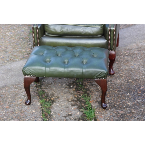 108 - GREEN LEATHER  CHESTERFIELD WINGBACK ARMCHAIR AND FOOTSTOOL
93 X 80 X 106CM