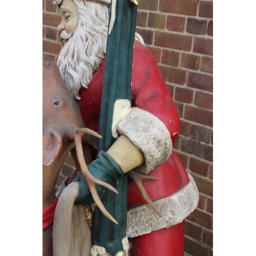 143 - LIFE SIZED SANTA WITH LIGHT UP PILLAR AND REINDEER 
170CM