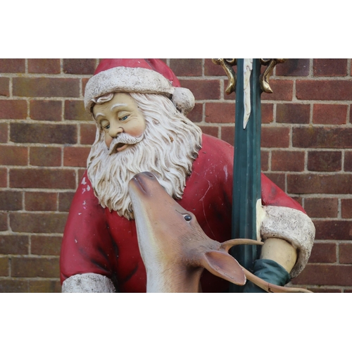 143 - LIFE SIZED SANTA WITH LIGHT UP PILLAR AND REINDEER 
170CM