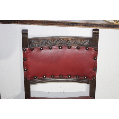 121 - SET OF FOUR RED LEATHER CHAIRS - 2 ARE CARVERS 
54 X 50 X 85CM