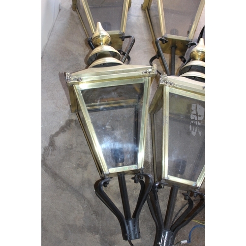 249 - FOUR BRASS LANTERN LAMPS AND BRACKETS 
35 X 93CM