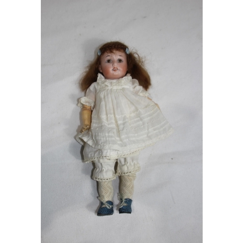 703 - ANTIQUE BISQUE GERMAN DOLL
24CM