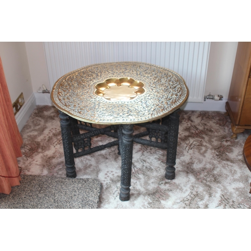 17 - VINTAGE ORIENTAL CARVED BASE BRASS TOPPED TABLE 
78 X 54CM