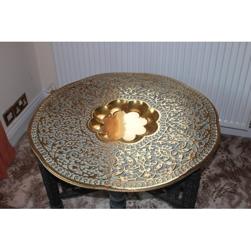 17 - VINTAGE ORIENTAL CARVED BASE BRASS TOPPED TABLE 
78 X 54CM