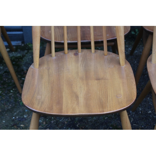 33 - BLONDE ERCOL SET OF FOUR GOLDSMITH CHAIRS 
43 X 42 X 98CM