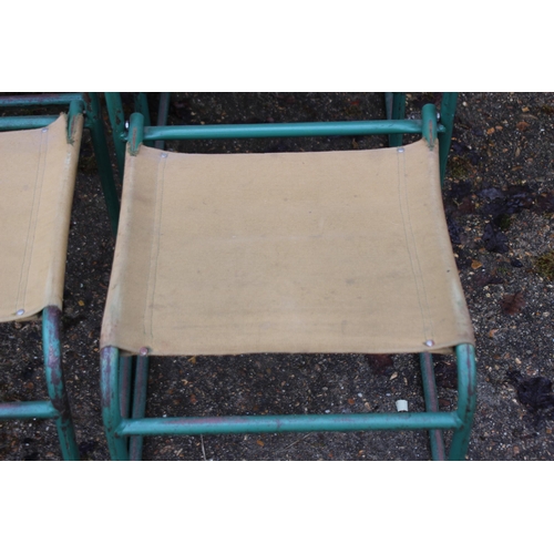 7 - SET OF FOUR VINTAGE RETRO REMPLOY MILITARY GREEN TUBULAR STEEL AND CANVAS STACKABLE CHAIRS
40 X 47 X... 