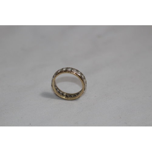 1312 - 9CT GOLD FULL ETERNITY RING - 3.61G - SIZE M