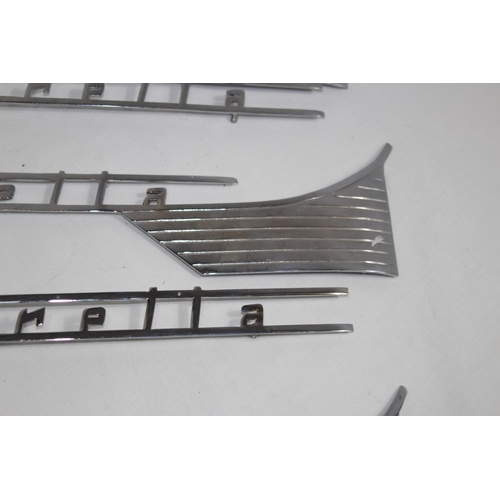 927 - QUANTITY OF LAMBRETTA CHROME INSIGNIA