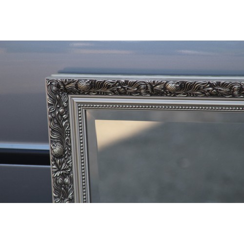 84 - ORNATE BEVELLED MIRROR
102 X 72CM