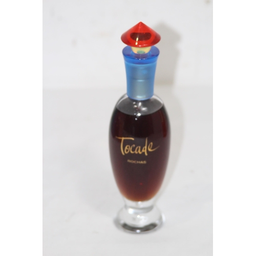 595 - BOTTLE OF VINTAGE ROCHAS TOCADE PERFUME