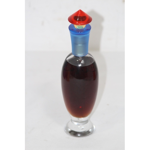 595 - BOTTLE OF VINTAGE ROCHAS TOCADE PERFUME