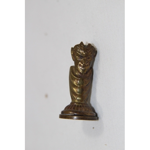 574 - NOVELTY VICTORIAN DEVIL FORM DESK SEAL AND A PLAIN SEAL
