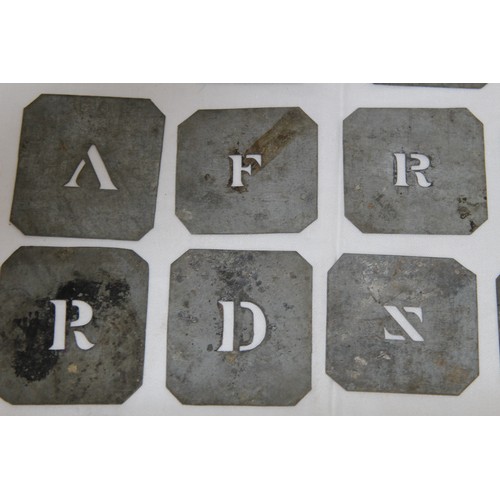 716 - QUANTITY OF ANTIQUE METAL STENCIL LETTERS