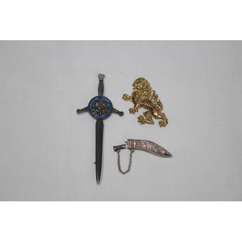 835 - VINTAGE SCOTTISH SWORD BROOCH, KUKRI BROOCH AND A LION