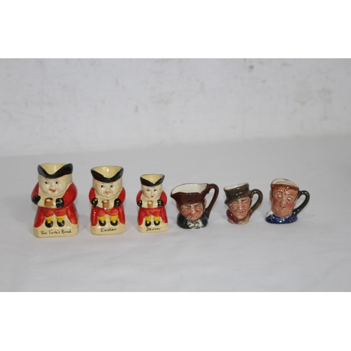 165 - QUANTITY OF MINIATURE TOBY JUGS MOSTLY ROYAL DOULTON
6cm