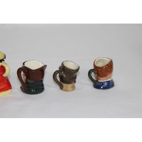 165 - QUANTITY OF MINIATURE TOBY JUGS MOSTLY ROYAL DOULTON
6cm