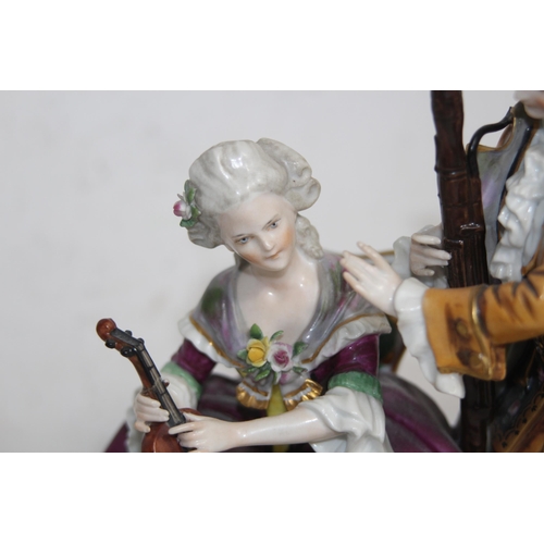 644 - ANTIQUE PORCELAIN MAN AND WOMEN FIGURE 
24 X 22CM