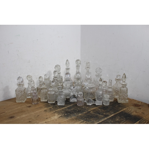 191 - LARGE QUANTITY OF MINIATURE DECANTERS 
21CM