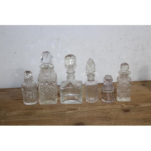 191 - LARGE QUANTITY OF MINIATURE DECANTERS 
21CM