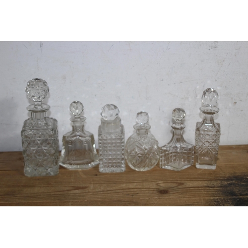 191 - LARGE QUANTITY OF MINIATURE DECANTERS 
21CM