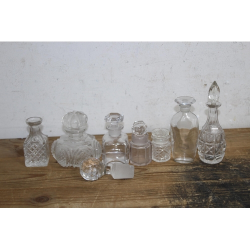 191 - LARGE QUANTITY OF MINIATURE DECANTERS 
21CM