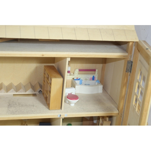 517 - WOODEN DOLLS HOUSE AND FURNITURE
60 X 25 X 69CM