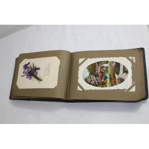 725 - VICTORIAN POSTCARD ALBUM
