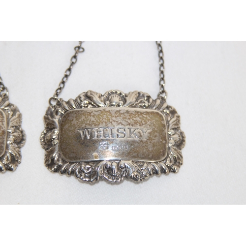 902 - THREE HALLMARKED SILVER DECANTER LABELS - 41.5G - LONDON 1977 + 1978 - ALAN WEISROSE