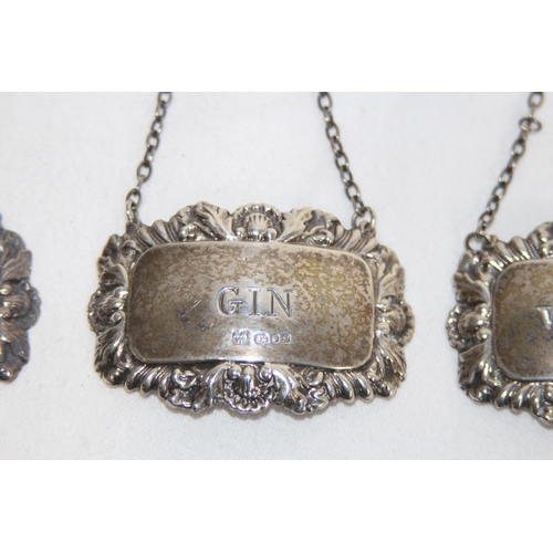 902 - THREE HALLMARKED SILVER DECANTER LABELS - 41.5G - LONDON 1977 + 1978 - ALAN WEISROSE