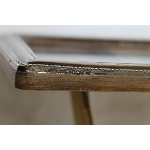 905 - COLLECTION OF 4 SILVER PICTURE FRAMES 
18 X 13CM