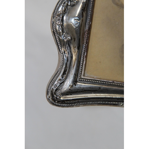 905 - COLLECTION OF 4 SILVER PICTURE FRAMES 
18 X 13CM