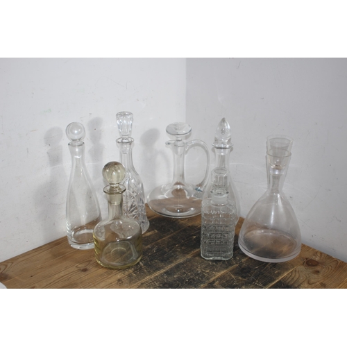 233 - SELECTION OF 7 VARIED DESIGN DECANTERS TO INCLUDE A SPOUTED CLARET DECANTER