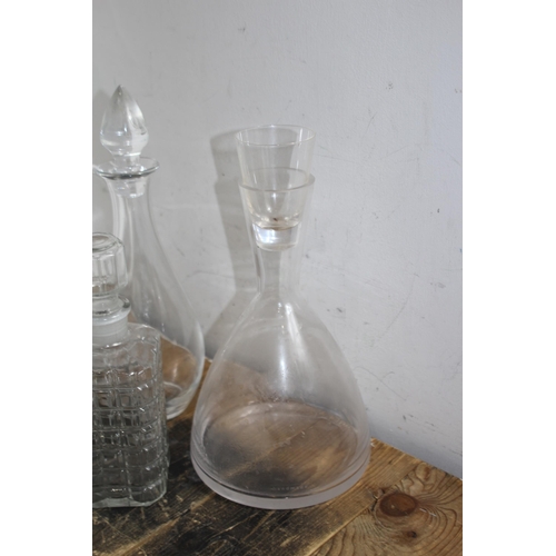 233 - SELECTION OF 7 VARIED DESIGN DECANTERS TO INCLUDE A SPOUTED CLARET DECANTER
