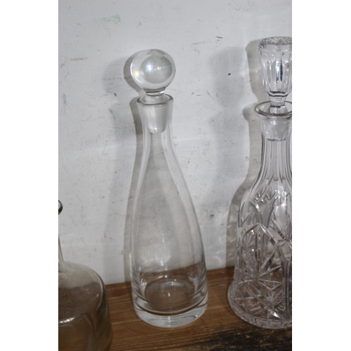 233 - SELECTION OF 7 VARIED DESIGN DECANTERS TO INCLUDE A SPOUTED CLARET DECANTER